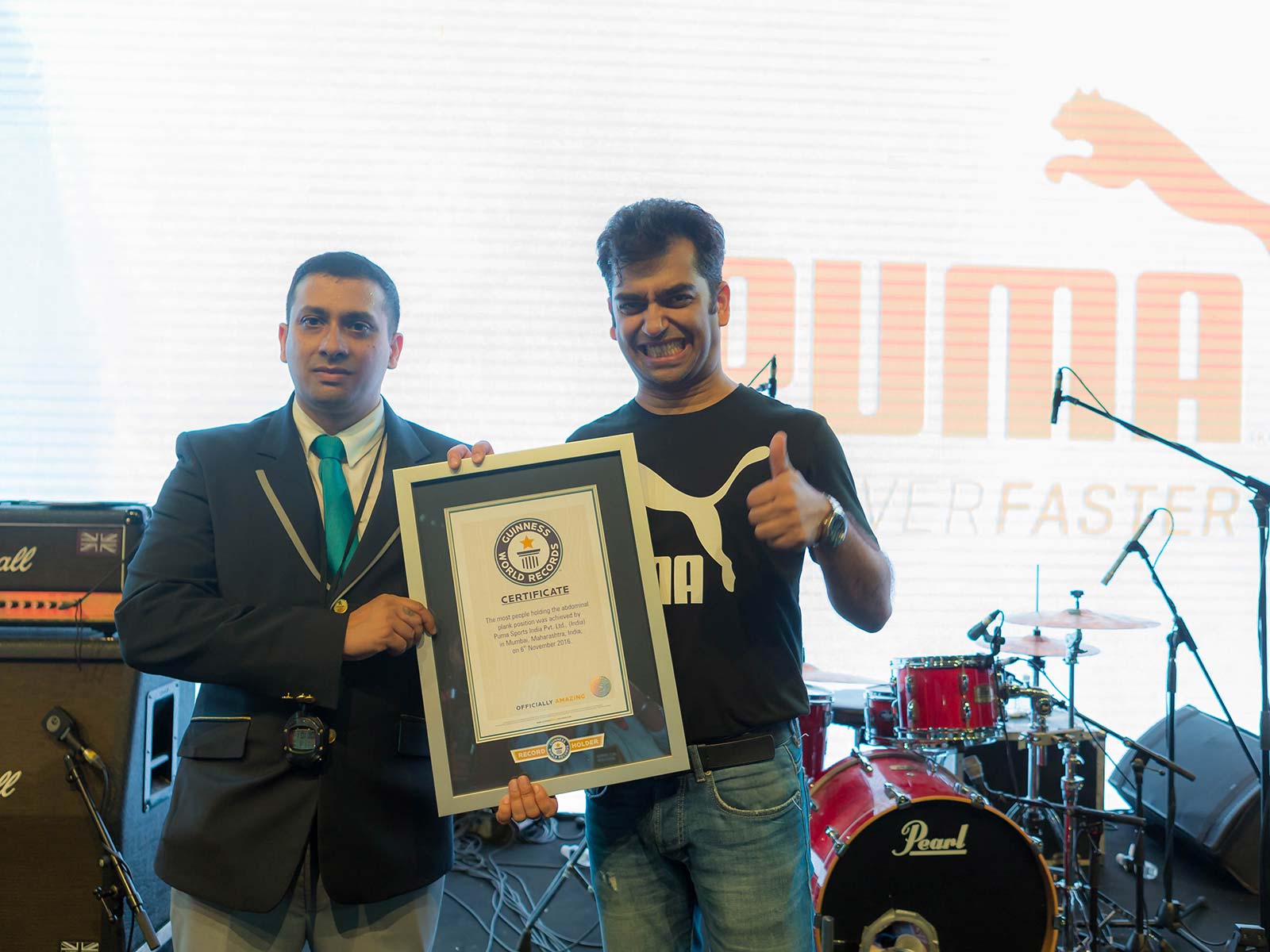 Abhishek Ganguly, MD, PUMA India accepts the Guinness World Record certificate for holding the abdominal plank simultaneously by largest number of women